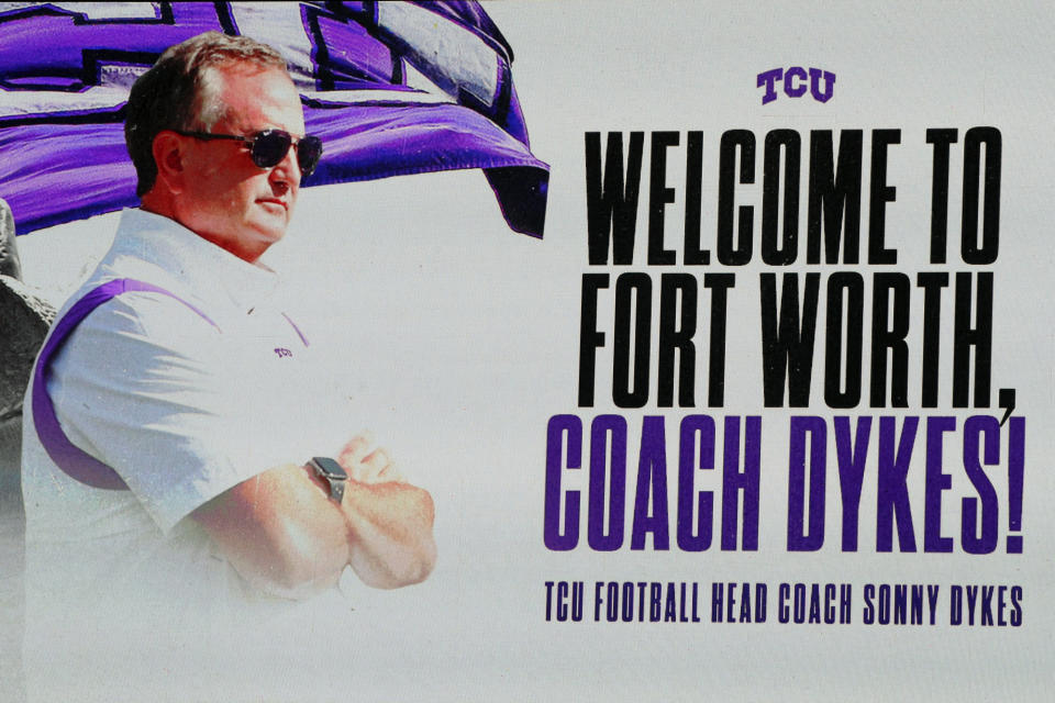 A message displayed on the video board introducing new TCU head football coach Sonny Dykes at Amon G. Carter Stadium at Texas Christian University, Monday, Nov. 29, 2021, in Fort Worth, Texas. (AP Photo/Richard W. Rodriguez)