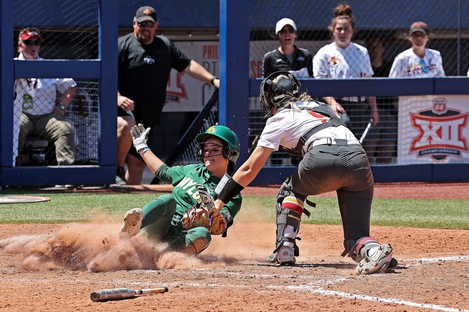 Iowa State catcher Natalie Wellet tags out a Baylor runner, who was trying to score from second. The runner was thrown out by center fielder Skyler Ramos in the eighth inning of the Cyclones' 2-1 win in the first round of the Big 12 softball tournament.