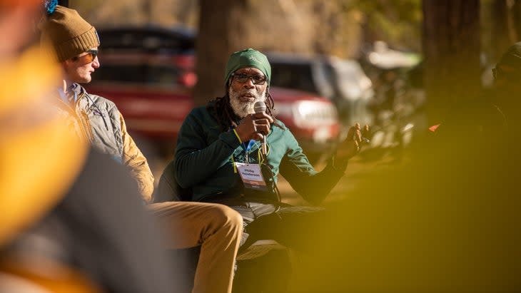 Man speaking to a crowd of people