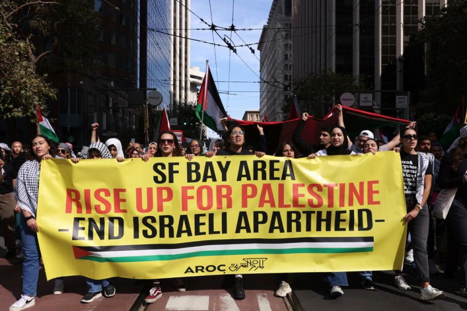 People march during a pro-Palestinian rally that began at Harry Bridges Plaza on Saturday (AP)