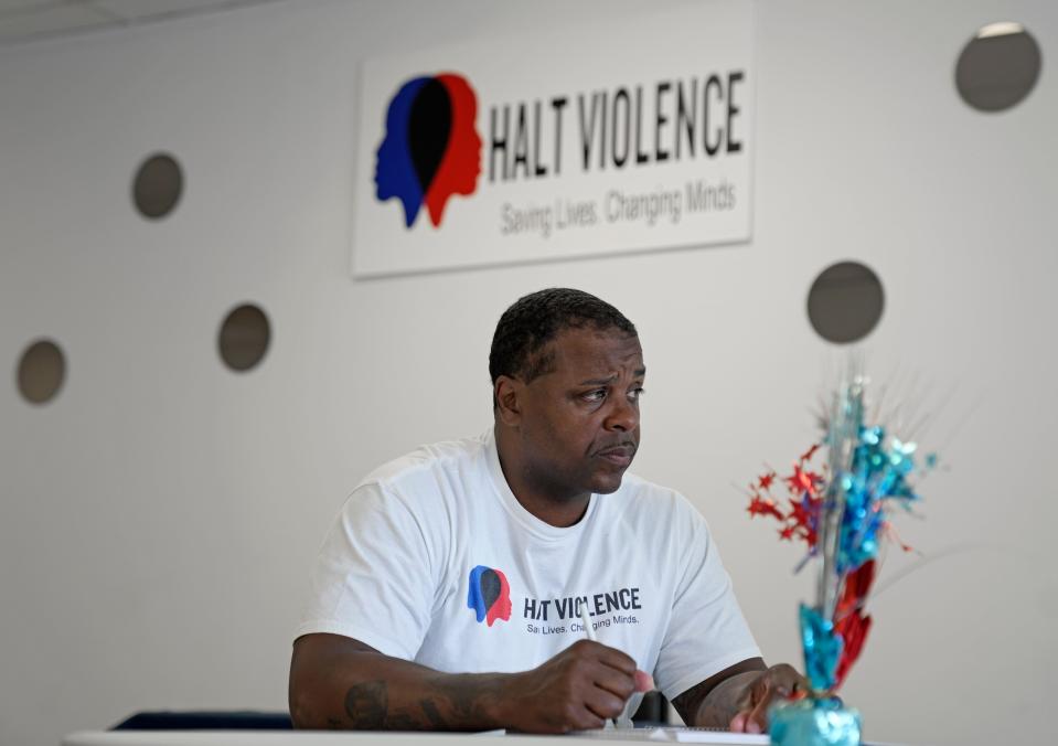 Thell Robinson founder of Halt Violence, does an intake interview June 21, 2023 at the organization's West Broad Street office. Halt Violence offers mediation and mentorship to at-risk teens and young adults. Robinson founded the organization after being incarcerated.