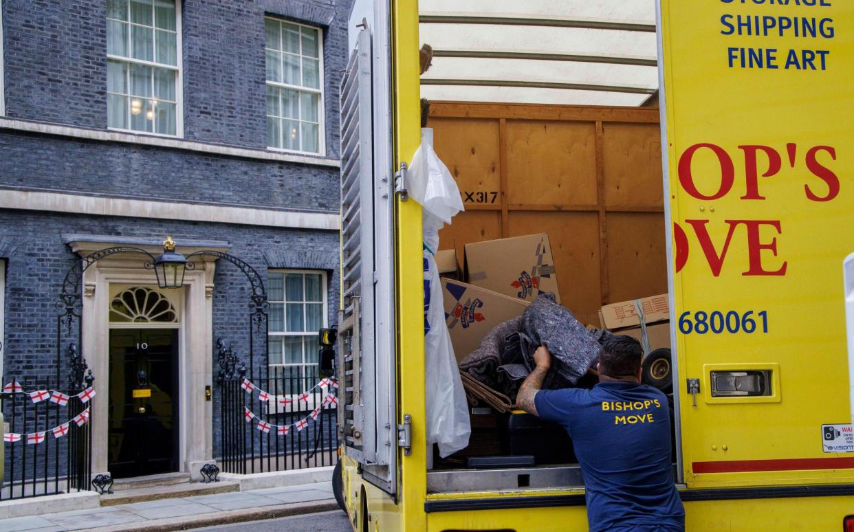 A moving van is pictured outside No 10 Downing Street this morning