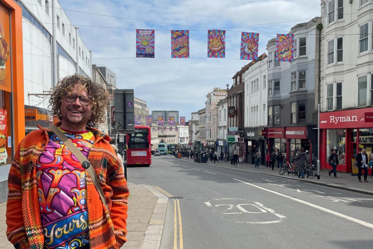 Dave Pop! with his artwork in Brighton city centre <i>(Image: Brilliant Brighton)</i>