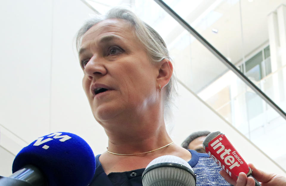 FILE - In this Monday, Sept. 23, 2019 file photo, Doctor Irene Frachon, who discovered that the drug Mediator could have fatal side effect, speaks to reporters as she arrived at a Paris courthouse. French pharmaceutical company Servier Laboratories is facing millions of euros in potential fines after a massive trial around a diabetes drug used as a diet pill. The popular drug, called Mediator, became one of France’s biggest modern health scandals. The trial is wrapping up Monday, July 6, 2020 after more than six months of exceptional proceedings targeting Servier and France’s medicines watchdog. (AP Photo/Michel Euler, File)