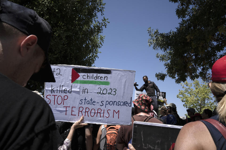 Israelis protest near the home of far-right National Security Minister Itamar Ben Gvir against plans by Benjamin Netanyahu's government efforts to overhaul the judiciary, in the West Bank settlement of Kiryat Arba, Friday, Aug. 25, 2023. (AP Photo/Maya Alleruzzo)