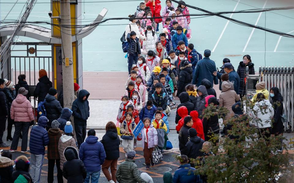 Students are dismissed from a school in Beijing, China