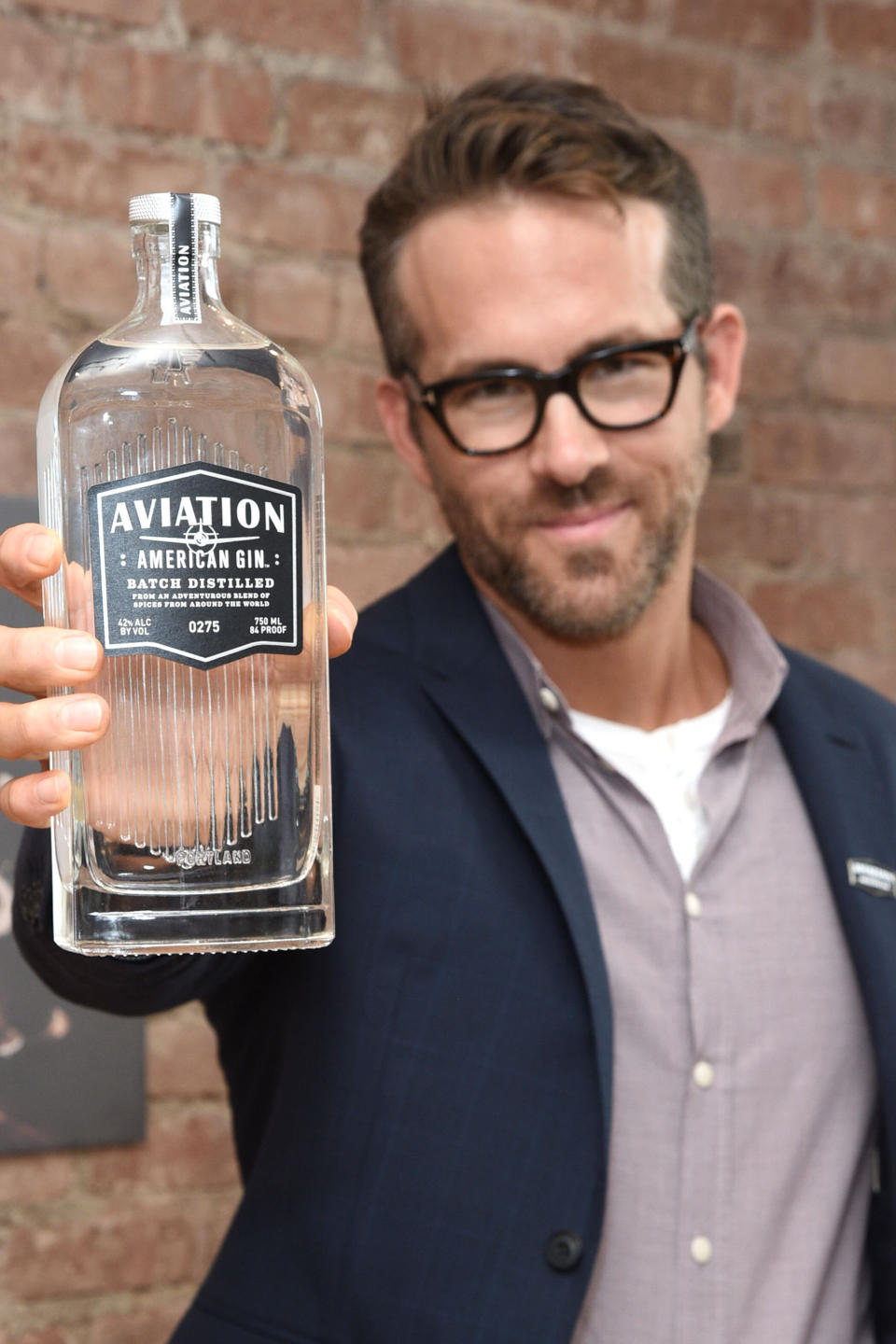 Give Ryan Reynolds props for the slightly embarrassed look on his face as he holds up this bottle of <a href="http://www.aviationgin.com/" target="_blank" rel="noopener noreferrer">Aviation Gin</a>. It's as if he's saying, "Look! I'm holding what might be called a 'noun,' a word used to describe a person, place or thing."
