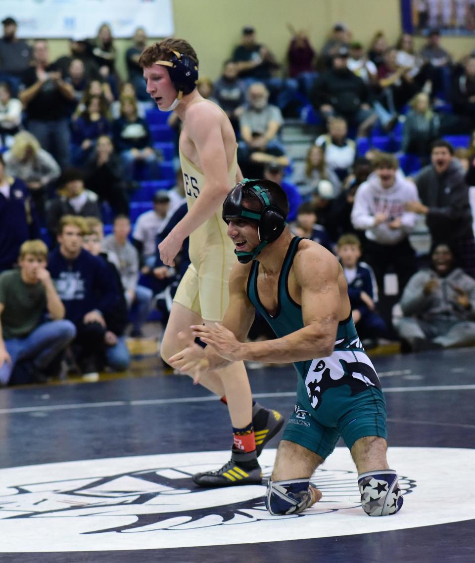 West Perry's Deven Jackson, front, celebrates a victory against Bald Eagle's Lucas Fye at last year's MyHouse Trojan Wars wrestling tournament at Chambersburg High School.