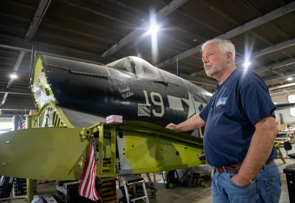 Dennis Bachtel shows the Goodyear Corsair that's being restored at the MAPS Air Museum. Goodyear donated the cockpit, which was part of its World of Rubber Museum until that attraction closed in 2009.