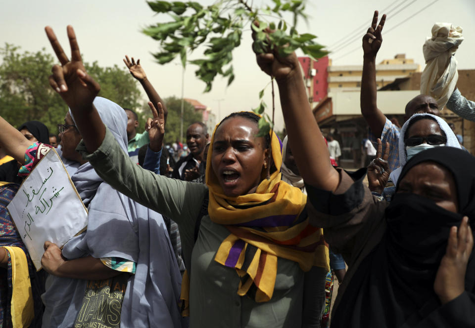 Sudanese take part in a protest over economic conditions, in Khartoum, Sudan, Wednesday, June 30, 2021. The World Bank and the International Monetary Fund said in a joint statement Tuesday, that Sudan has met the initial criteria for over $50 billion in foreign debt relief, another step for the East African nation to rejoin the international community after nearly three decades of isolation. (AP Photo/Marwan Ali)