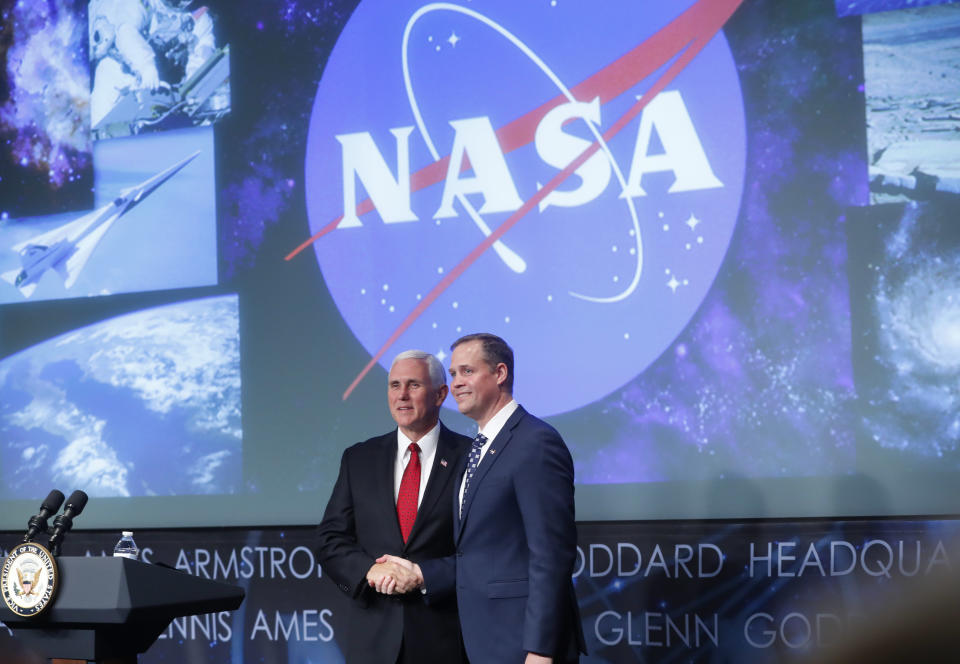 Vice President Mike Pence shakes hands with Bridenstine during a swearing-in ceremony in April 2018 at NASA headquarters in Washington. (Photo: Pablo Martinez Monsivais/AP)