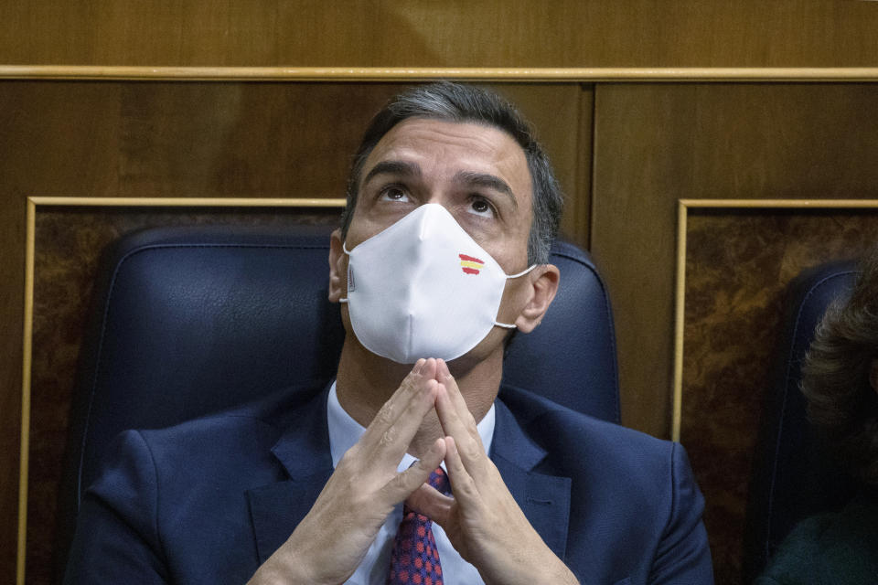 Spain's Prime Minister Pedro Sanchez listens to the proceedings during a parliamentary session in Madrid, Spain, Thursday Oct. 22, 2020. Sanchez is facing a no-confidence vote in parliament brought by the nation's far-right Vox party. (Pablo Blazquez Dominguez/Pool via AP)