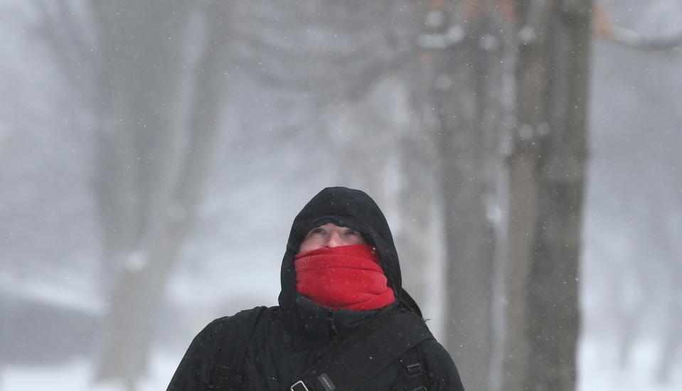 Man walking through the cold in February 2016.