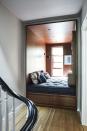 <p>Where we see an awkward stair landing, Erin Fearins sees a hangout. Encased in a walnut frame, this nook by Fearins Welch Design and <a href="https://cwbinteriors.com/" rel="nofollow noopener" target="_blank" data-ylk="slk:CWB Architects;elm:context_link;itc:0;sec:content-canvas" class="link ">CWB Architects</a> is spacious enough for two brothers to convene for video games. </p>