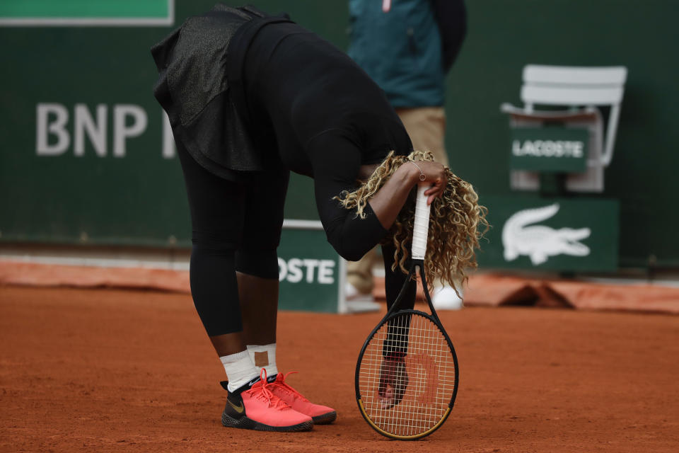 Serena Williams of the U.S. reacts after missing a shot against Kristie Ahn of the U.S. in the first round match of the French Open tennis tournament at the Roland Garros stadium in Paris, France, Monday, Sept. 28, 2020. (AP Photo/Alessandra Tarantino)