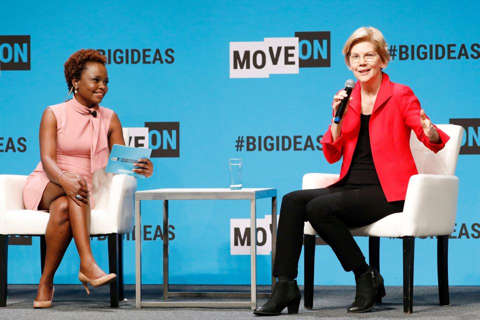 SAN FRANCISCO, CALIFORNIA - JUNE 01: Karine Jean-Pierre and Elizabeth Warren speak onstage at the MoveOn Big Ideas Forum at The Warfield Theatre on June 01, 2019 in San Francisco, California.