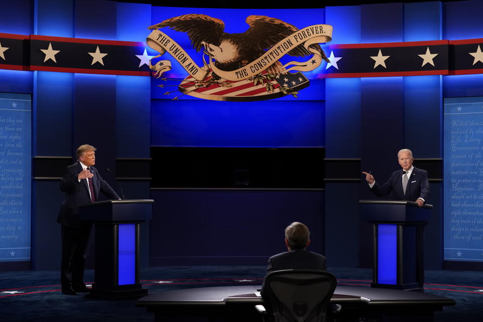 President Donald Trump, left, and Democratic presidential candidate former Vice President Joe Biden, right, with moderator Chris Wallace, center, of Fox News during the first presidential debate Tuesday, Sept. 29, 2020, at Case Western University and Cleveland Clinic, in Cleveland, Ohio. (AP Photo/Patrick Semansky)