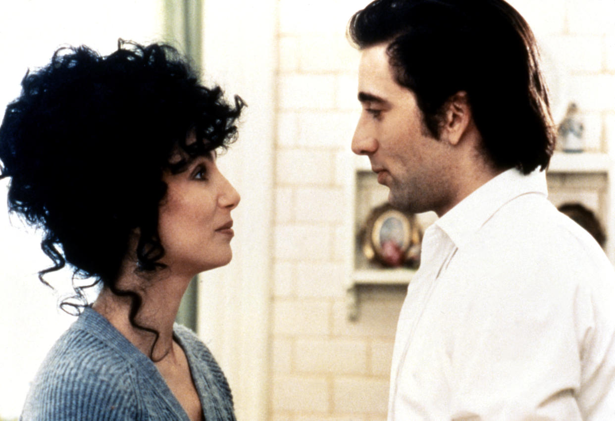 American actress and singer Cher and actor Nicolas Cage on the set of Moonstruck, directed and produced by Canadian Norman Jewison. (Photo by Sunset Boulevard/Corbis via Getty Images)