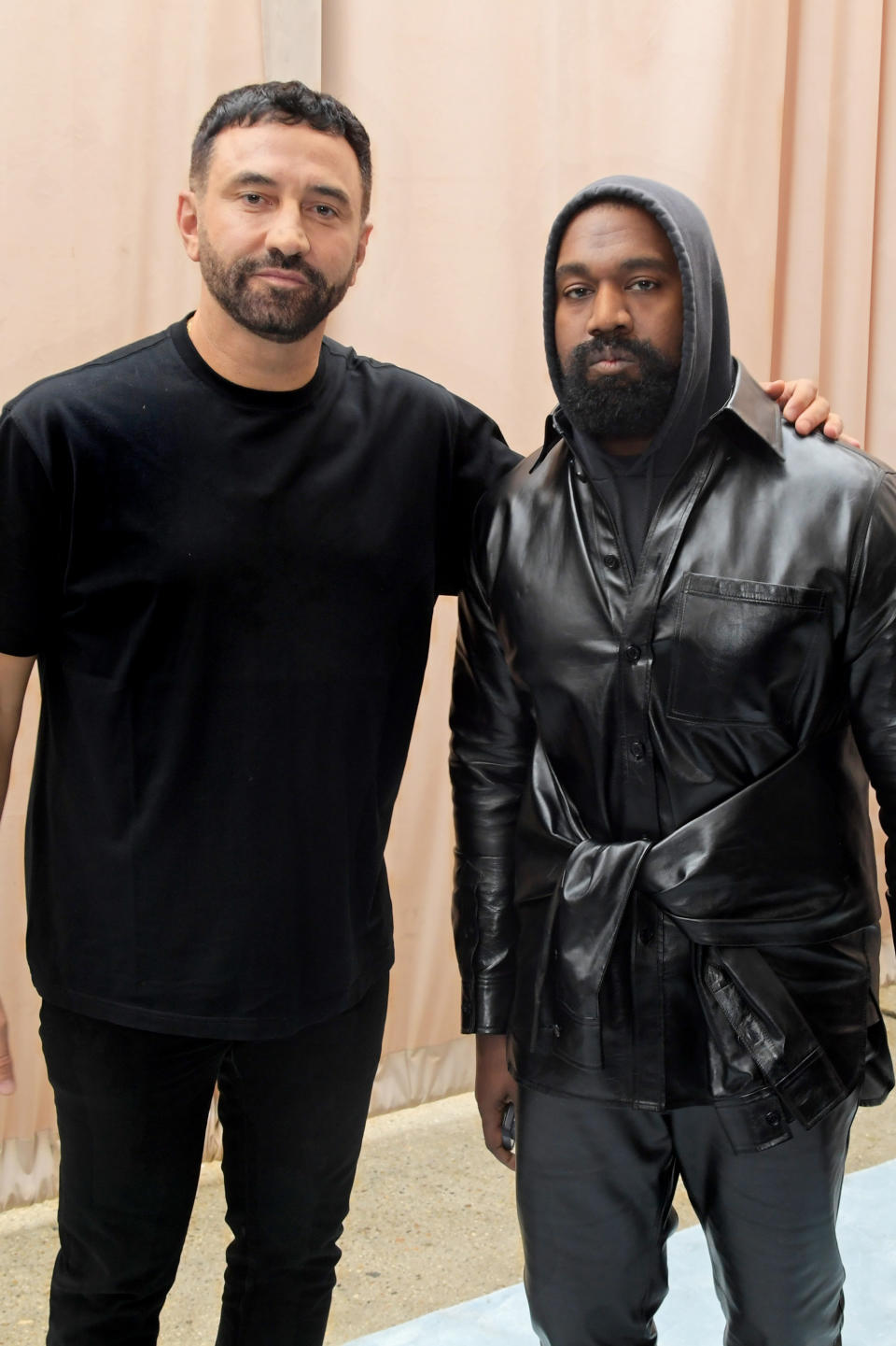 LONDON, ENGLAND - SEPTEMBER 26: CCO of Burberry Riccardo Tisci and Kanye West pose backstage at the Burberry Spring/Summer 2023 runway show in Bermondsey on September 26, 2022 in London, England. (Photo by David M. Benett/Dave Benett/Getty Images for Burberry)