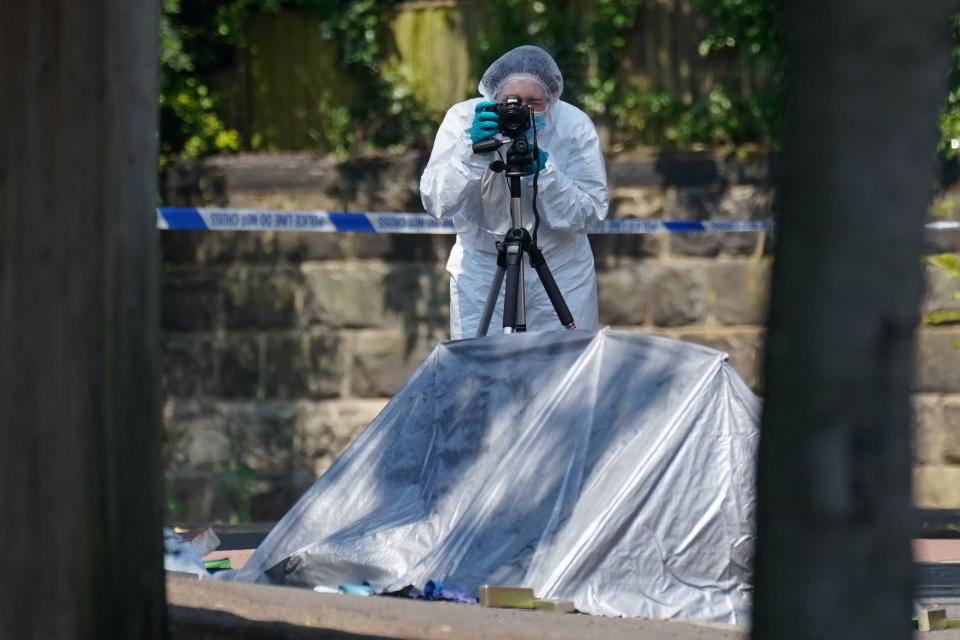 A police forensic officer at the scene on Magdala road, Nottingham (PA Wire)