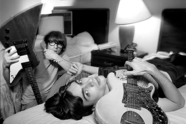 Rivers Cuomo (left) and Brian Bell (right) relax at their hotel before a Weezer show on August 26, 1994 in New York City, New York.  - Credit: Karjean Levine/Getty Images)