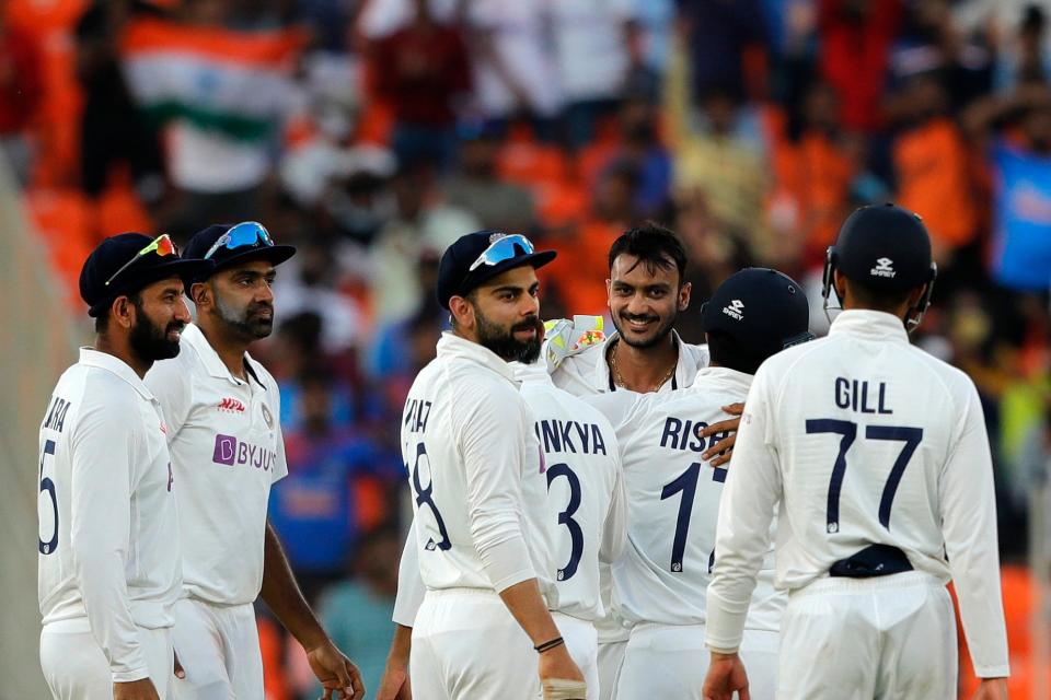 India celebrate after Axar takes a wicket on day oneBCCI