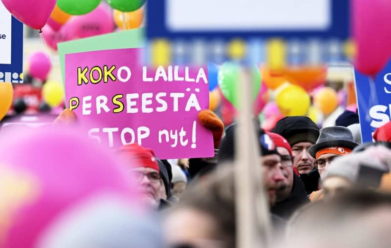 People take part in a demonstration organised by SAK and STTK against labour market reforms planned by the conservative government at the Senate Square. Vesa Moilanen/Lehtikuva/dpa
