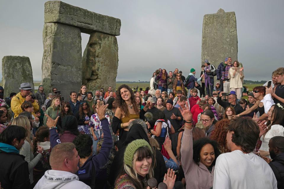 Revelers gather at the ancient stone circle Stonehenge to celebrate the Summer Solstice, the longest day of the year, near Salisbury, England, Wednesday, June 21, 2023.