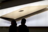 Employees work at the SoHo Apple Store in New York, October 27, 2015. REUTERS/Brendan McDermid