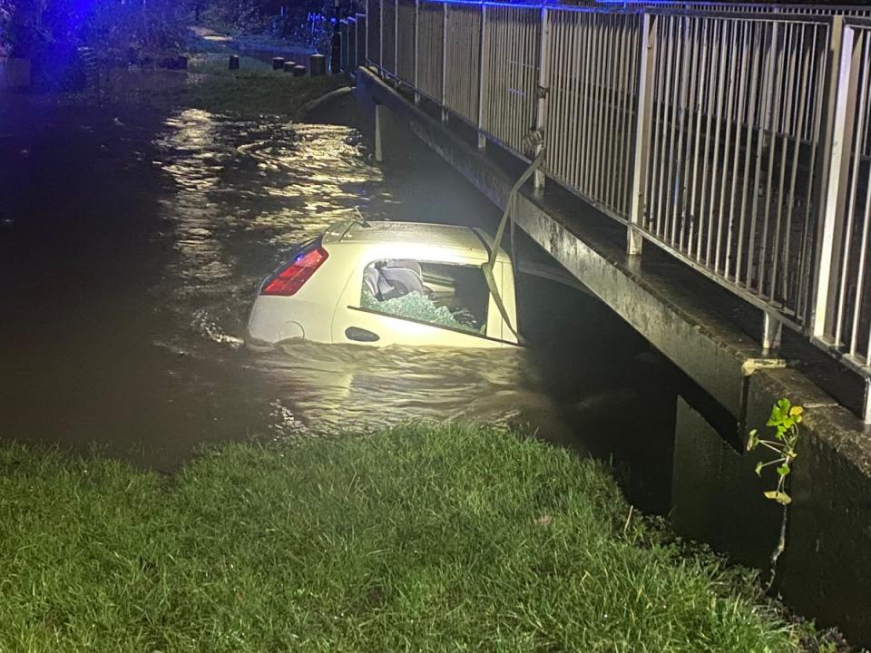 A driver and child were rescued from a car in floods in Birmingham (West Midlands Police)