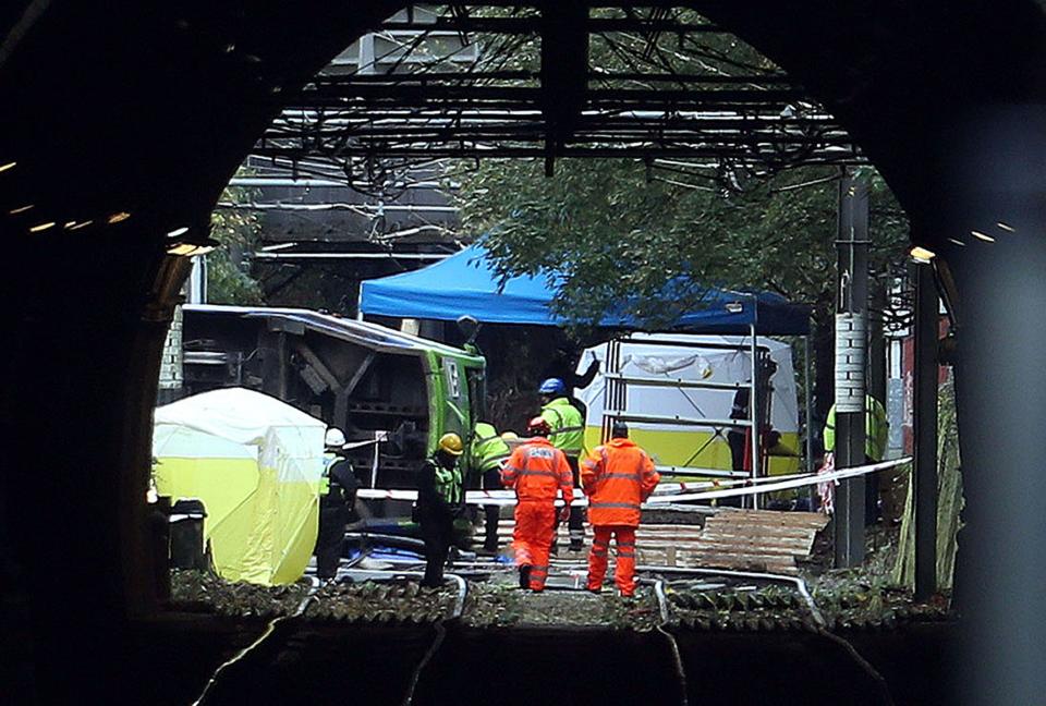 File photo dated 10/11/16 of investigators at the scene after a tram derailed and overturned in Croydon, south London. Tram driver Alfred Dorris is set to stand trial at crown court over his alleged role in the Croydon crash that claimed the lives of seven passengers in 2016. he has denied a charge of failing to take reasonable care at work under the Health and Safety at Work Act 1974. Issue date: Friday July 8, 2022.
