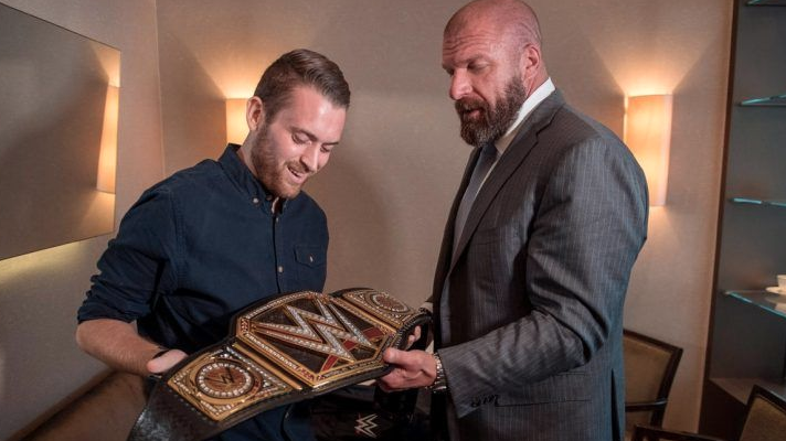 London police officer Charlie Guenigault meets Triple H. Photo: WWE
