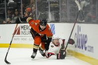 Ottawa Senators' Brady Tkachuk, right, is checked by Anaheim Ducks' Cam Fowler during the first period of an NHL hockey game Friday, Nov. 26, 2021, in Anaheim , Calif. (AP Photo/Jae C. Hong)