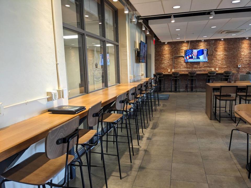 Seating areas along the walls at Matt’s Café in Belleville provide customers with charging stations for laptops, phones and other devices.