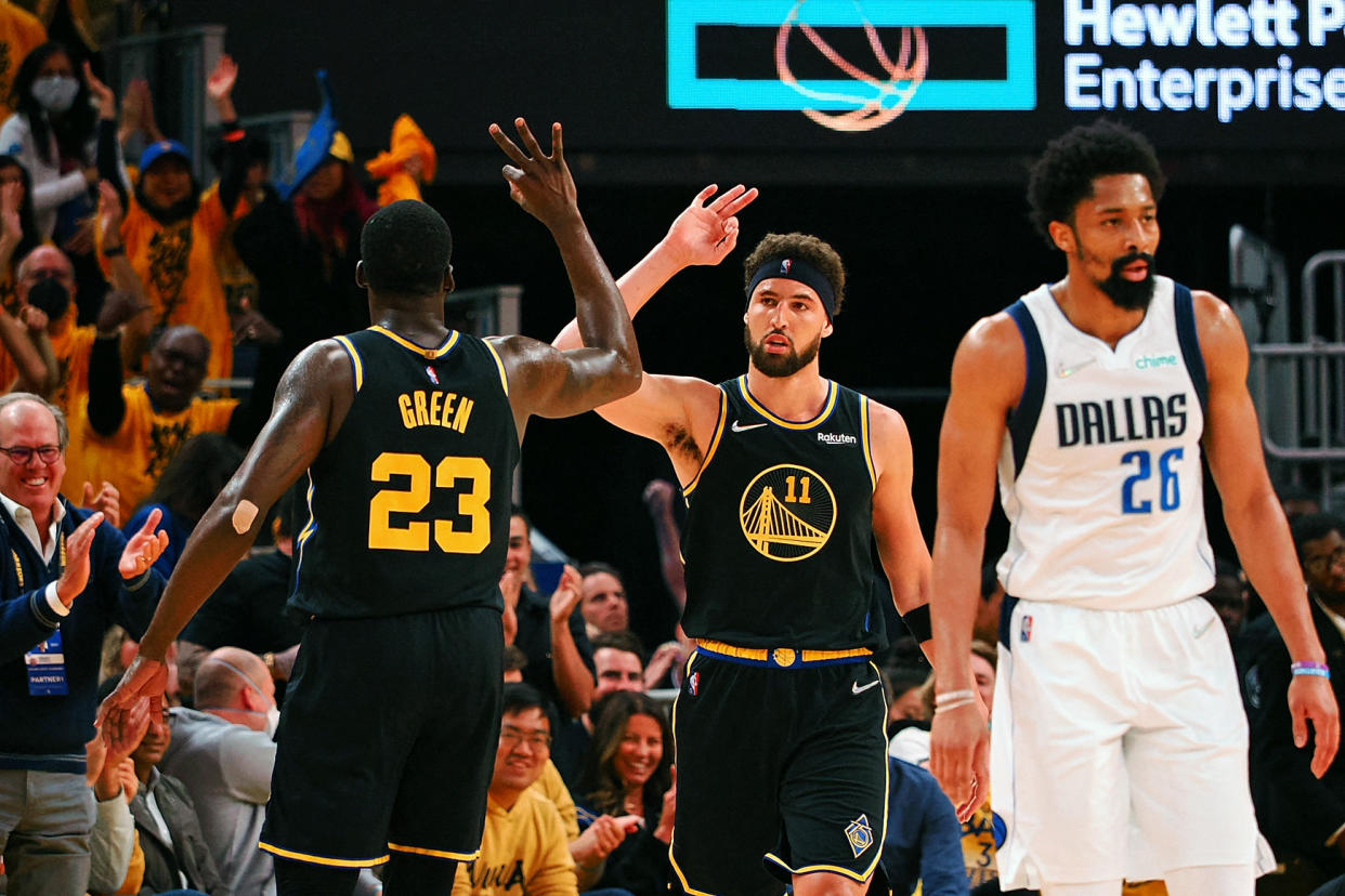 Golden State Warriors guard Klay Thompson celebrates a 3-pointer with forward Draymond Green during Game 5 of the Western Conference finals against the Dallas Mavericks at Chase Center in San Francisco on May 26, 2022. (Kelley L Cox/USA TODAY Sports)