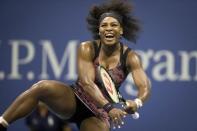 Serena Williams of the U.S. reacts after returning a shot to her sister and compatriot Venus Williams during their quarterfinals match at the U.S. Open Championships tennis tournament in New York, September 8, 2015. REUTERS/Carlo Allegri