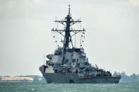 <p>A general view shows the guided-missile destroyer USS John S. McCain with a hole on its left portside after a collision with oil tanker, outside Changi naval base in Singapore on Aug. 21, 2017. (Photo: Roslan Rahman/AFP/Getty Images) </p>