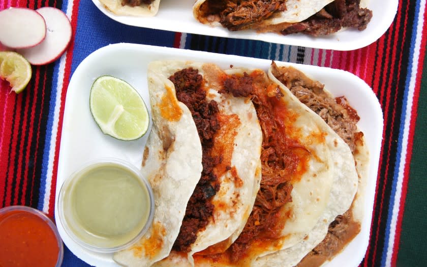 LOS ANGELES, CA - OCTOBER 17: Two mixed plates of tacos are photographed at El Ruso in East Los Angeles on Saturday, Oct. 17, 2020 in Los Angeles, CA. They serve handmade artisanal Sonoran flour tortillas and sobaqueras. (Dania Maxwell / Los Angeles Times)