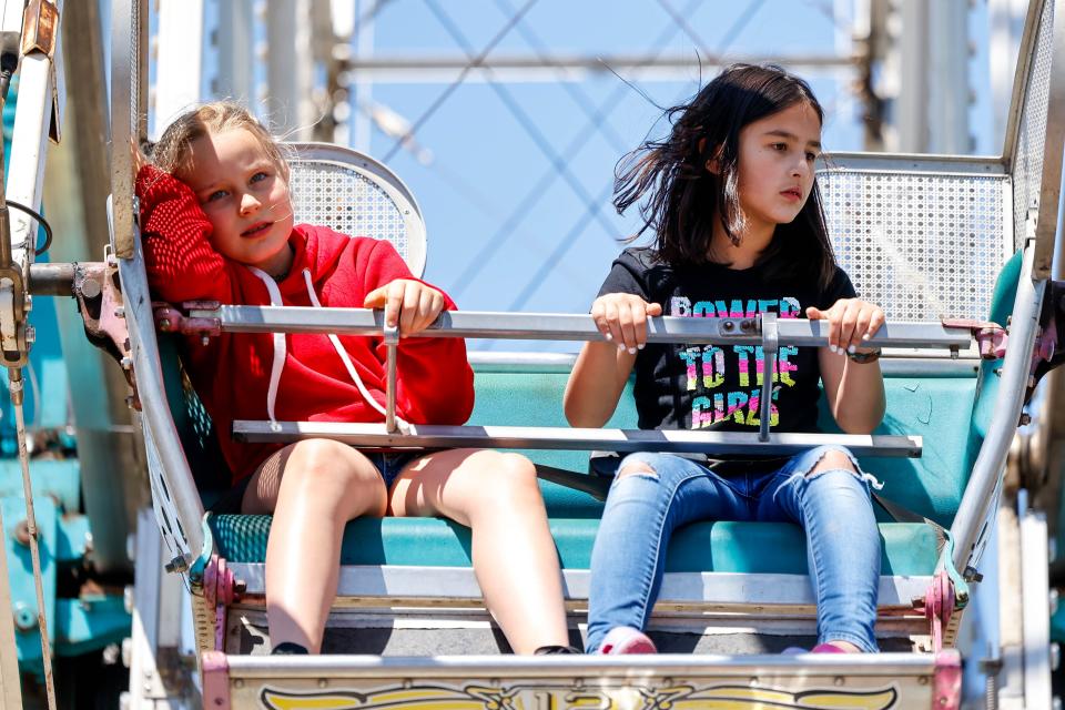 Festivalgoers ride the Ferris wheel April 29, 2023, during the Norman Music Festival.