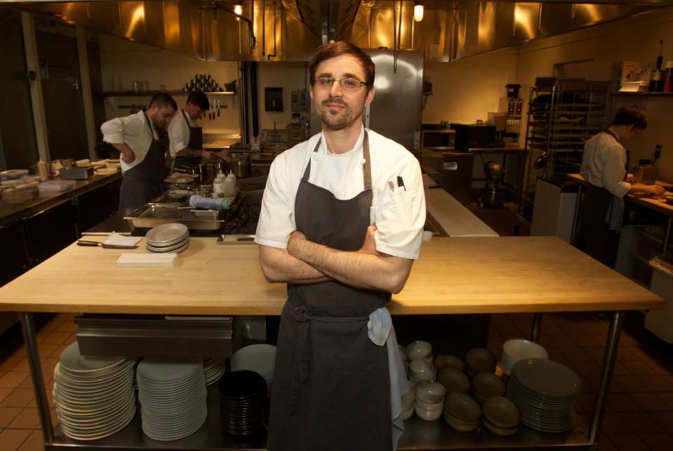 In this April 17, 2013 photo, Chef Justin Woodward stands in the kitchen of the restaurant Castagna in Portland, Ore. Far from the expectant gaze of major restaurant critics and the accompanying pressure to produce the Next Big Thing, the little-big city of Portland offers chefs a unique opportunity - the chance to experiment. (AP Photo/The Oregonian, Doug Beghtel)