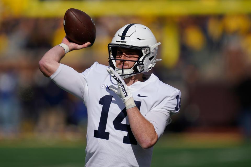 Penn State quarterback Sean Clifford (14) throws against Michigan in the first half of an NCAA college football game in Ann Arbor, Mich., Saturday, Oct. 15, 2022. (AP Photo/Paul Sancya)