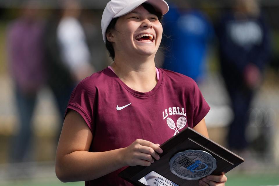 La Salle’s Arianna DeThomas with the runner-up plaque in yesterday's singles championship.