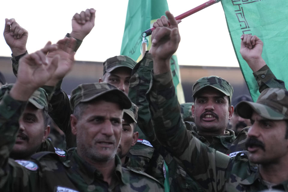 Members of an Iraqi Shiite militant group attend the funeral of an fighter who was killed in a U.S. airstrike Province, in Baghdad, Iraq, Thursday, Jan. 4, 2024. The Popular Mobilization Force - a coalition of militias that is nominally under the control of the Iraqi military - announced in a statement that its deputy head of operations in Baghdad, Mushtaq Taleb al-Saidi, or "Abu Taqwa," had been killed in the strike. (AP Photo/Hadi Mizban)