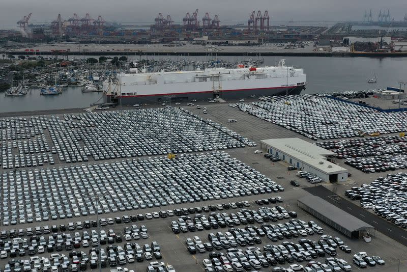 FILE PHOTO: New cars are seen lined up next to the dock as the global outbreak of the coronavirus disease (COVID-19) continues, at the Port of Los Angeles