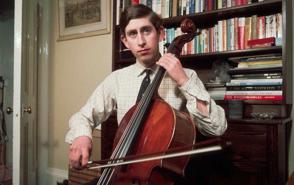 The then Prince Charles practicing cello in his rooms at Trinity College Cambridge, 1969 - Getty