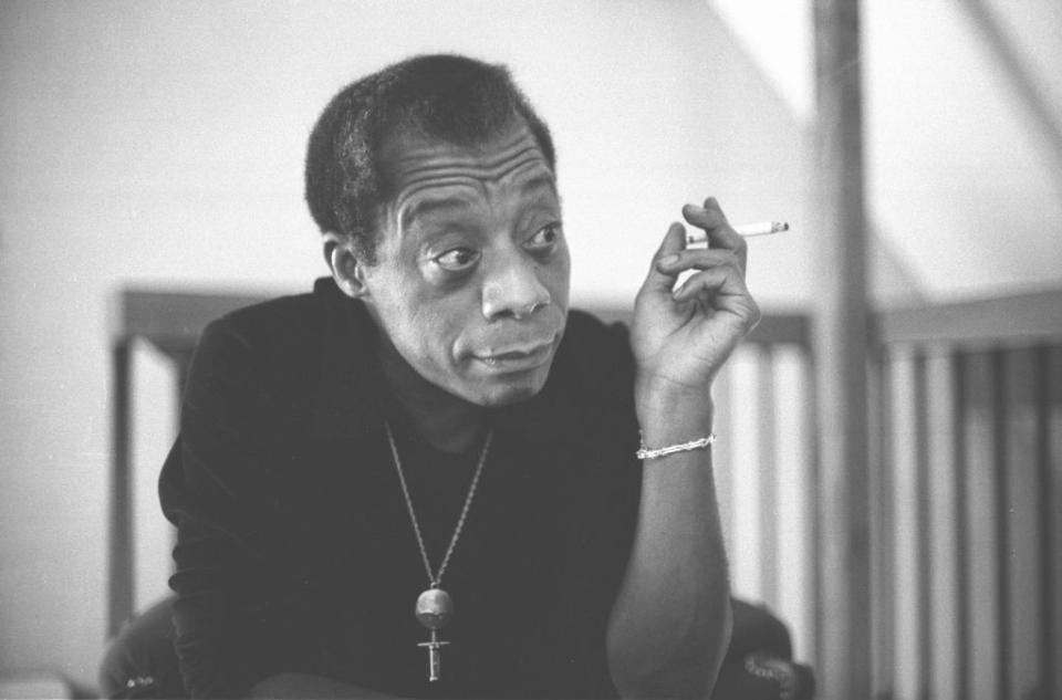 <p>Though he spent much of his adult life in France, James Baldwin was a native New Yorker, born in Harlem in 1924 at the height of the Harlem Renaissance. His work spans genres and mediums; he is known as a prolific playwright, essayist, activist, poet and novelist. Baldwin’s work frequently explores themes of masculinity, sexuality, race, and class, and his characters find themselves exploring ostracism, desire for social capital, and self-acceptance. Harlem and his own experiences growing up there were also made known in his work, his harassment from racist police officers at the age of 10 was documented in his essays, and his birthday and father’s death coinciding with the Harlem riot of 1943 was portrayed in the beginning of his <em>Notes of a Native Son</em> essay. He is most known for his earlier works, including <em>Go Tell it On a Mountain</em>, <em>Notes of a Native Son</em>, <em>Giovanni’s Room</em>, and <em>The Fire Next Time</em>.</p>