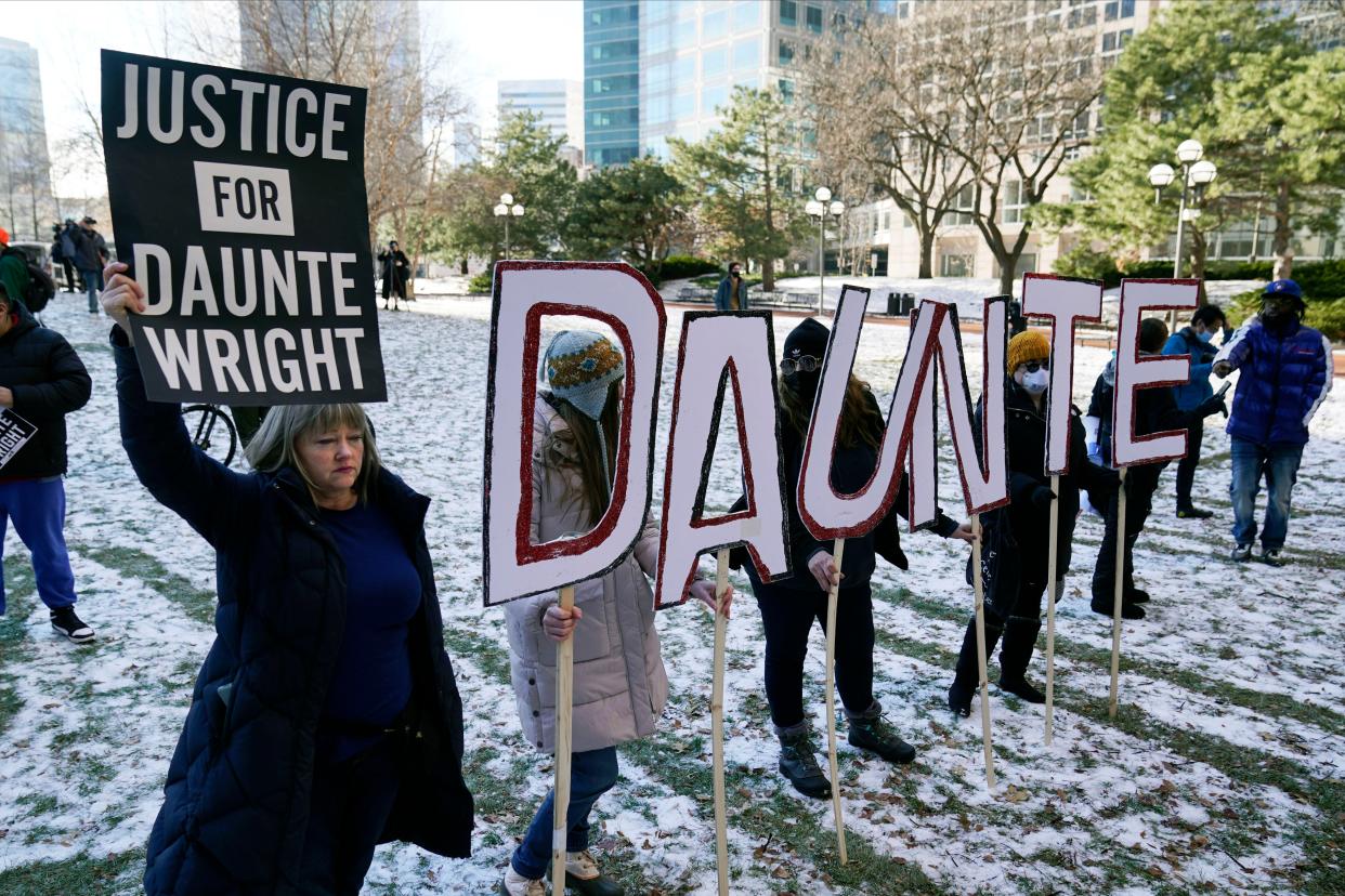 Demonstrators gather at the Hennepin County Government Center in Minneapolis where jurors found former suburban Minneapolis police officer Kim Potter guilty of first degree and second degree manslaughter.