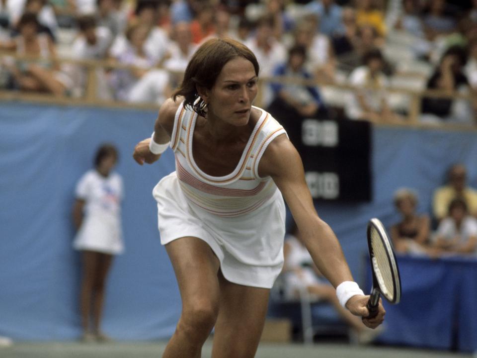 Renee Richards in action with tennis racket in hand.