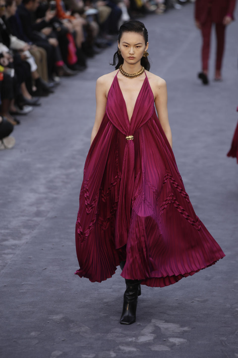 A model wears a creation as part of the Roberto Cavalli women's Fall-Winter 2019-2020 collection, that was presented in Milan, Italy, Saturday, Feb.23, 2019. (AP Photo/Luca Bruno)