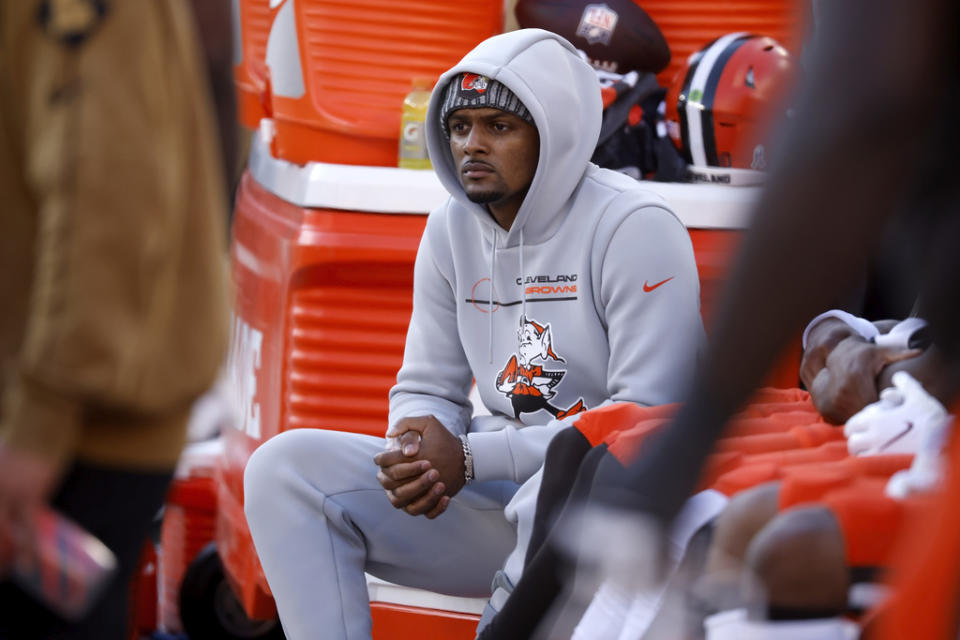 FILE – Cleveland Browns quarterback Deshaun Watson (4) sits on the bench during an NFL football game against the <a class="link " href="https://sports.yahoo.com/nfl/teams/pittsburgh/" data-i13n="sec:content-canvas;subsec:anchor_text;elm:context_link" data-ylk="slk:Pittsburgh Steelers;sec:content-canvas;subsec:anchor_text;elm:context_link;itc:0">Pittsburgh Steelers</a>, Sunday, Nov. 19, 2023, in Cleveland. For the third straight year, Cleveland is without a first-round pick after shipping three along with a handful of late-round selections to the Houston Texas in 2022 for Watson, who has yet to deliver a championship or even a playoff win. (AP Photo/Kirk Irwin, File)